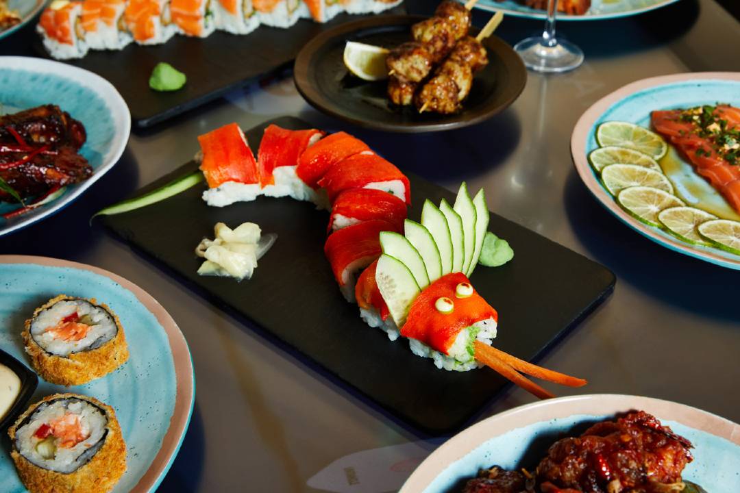 A photo of a Red Dragon roll laid out on a table.